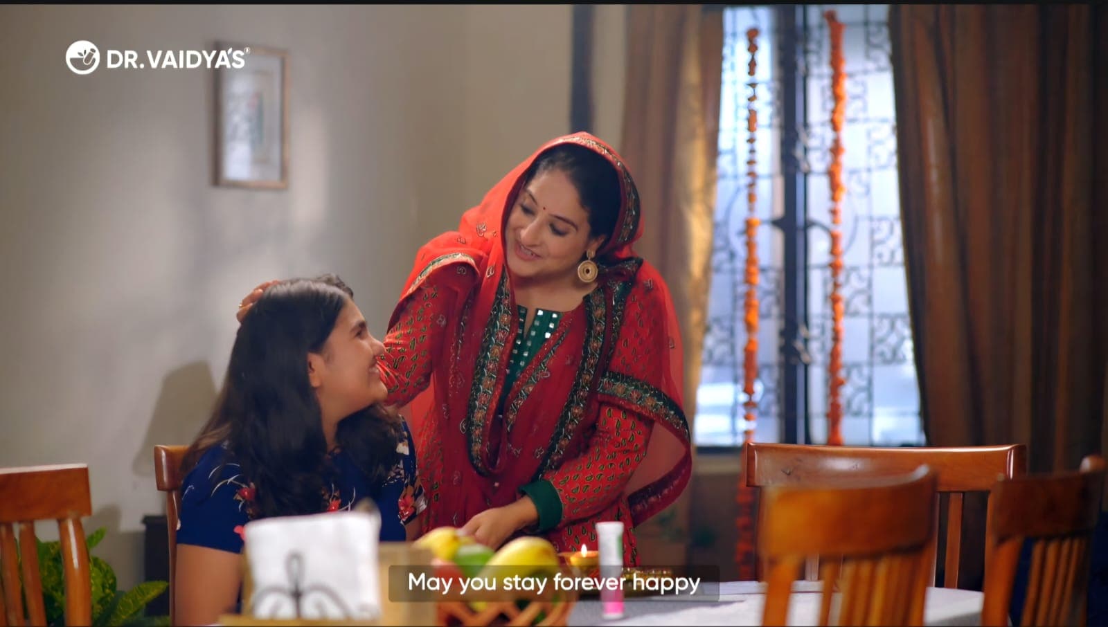 TVC still of a mother blessing her daughter