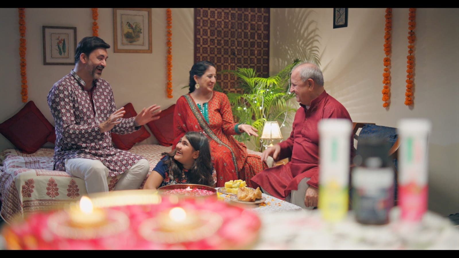 Family laughing at a Diwali gathering