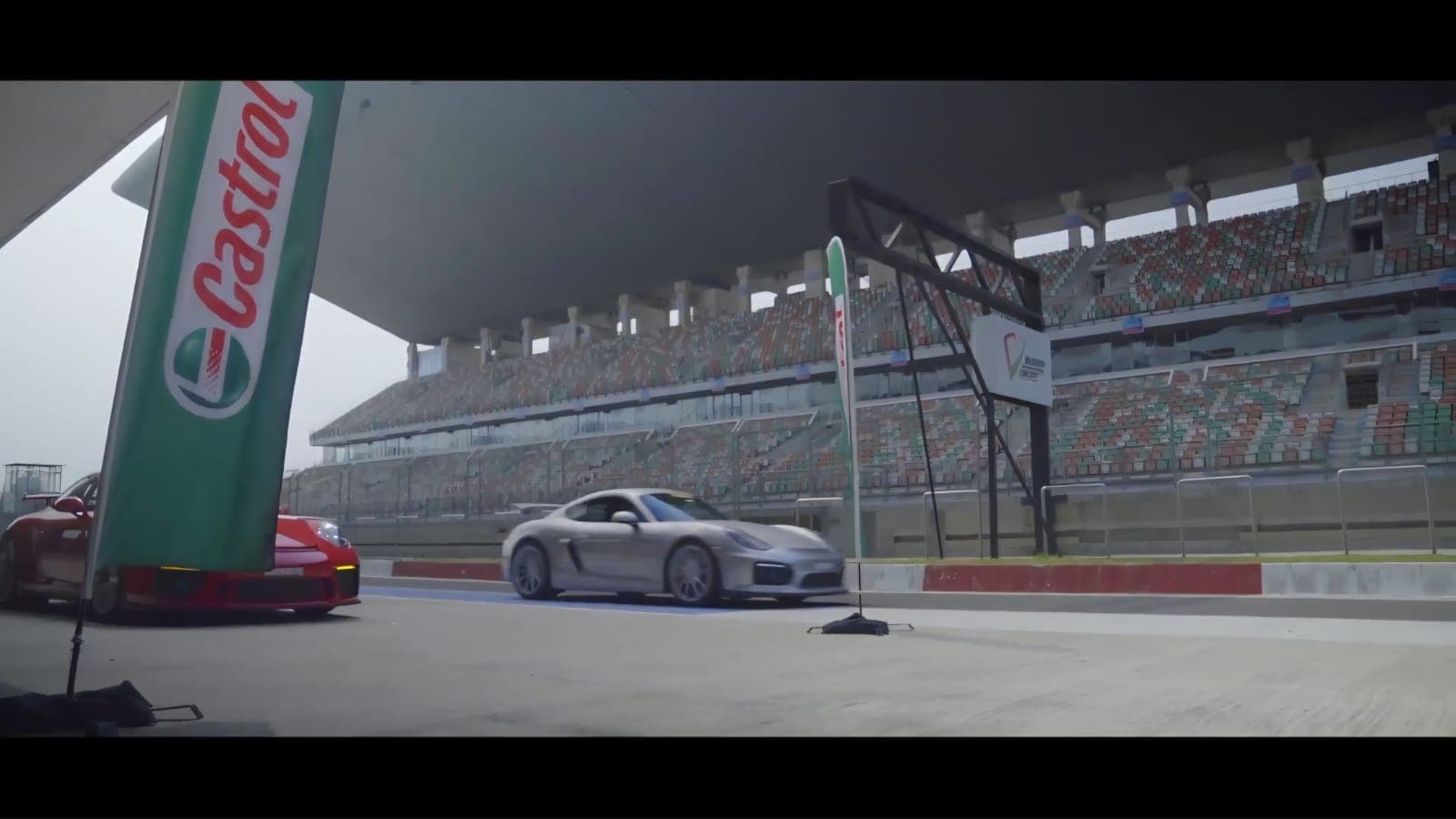 Porsches rolling through the pit lane