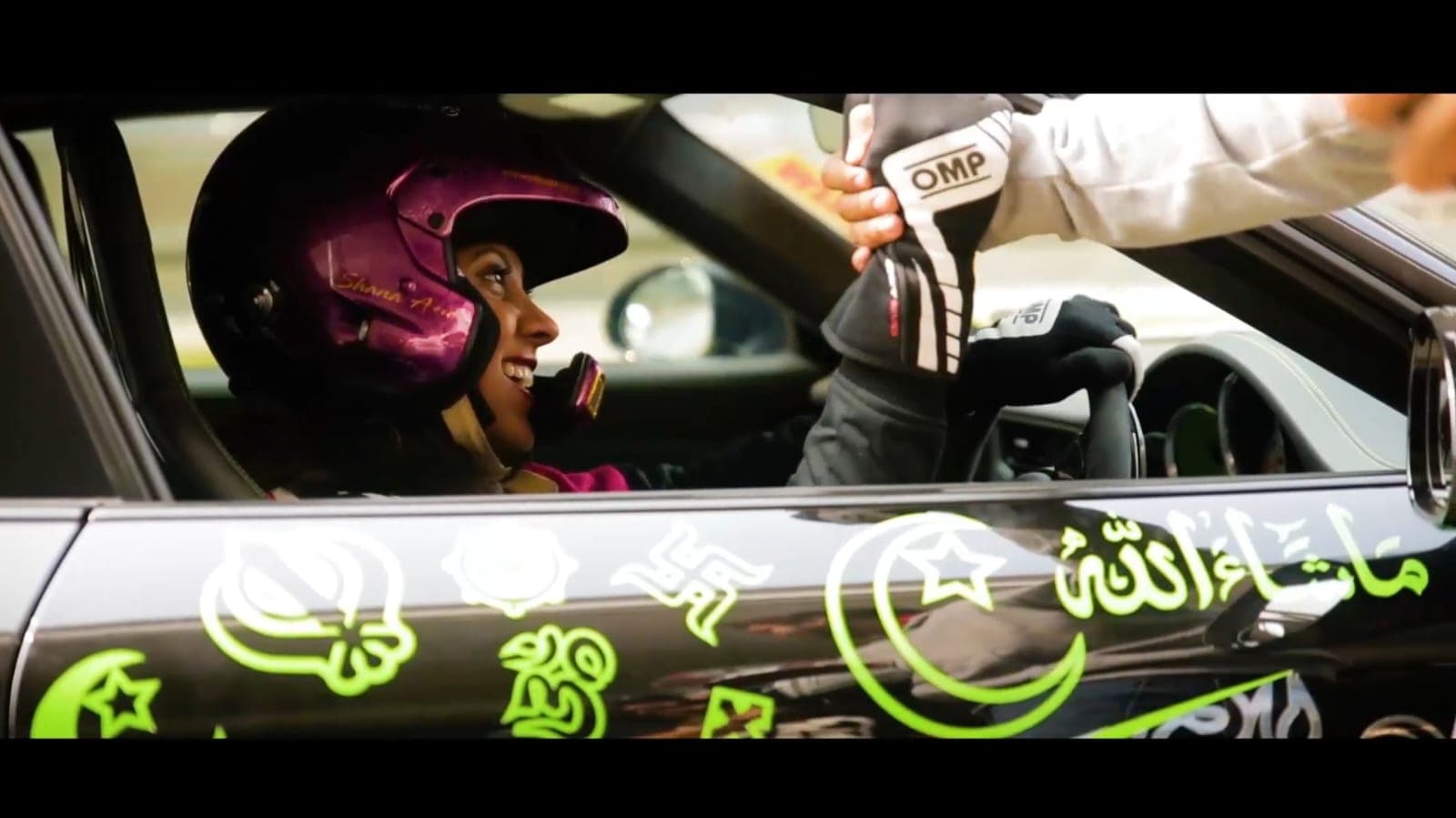 Driver fist-bump in a drift car