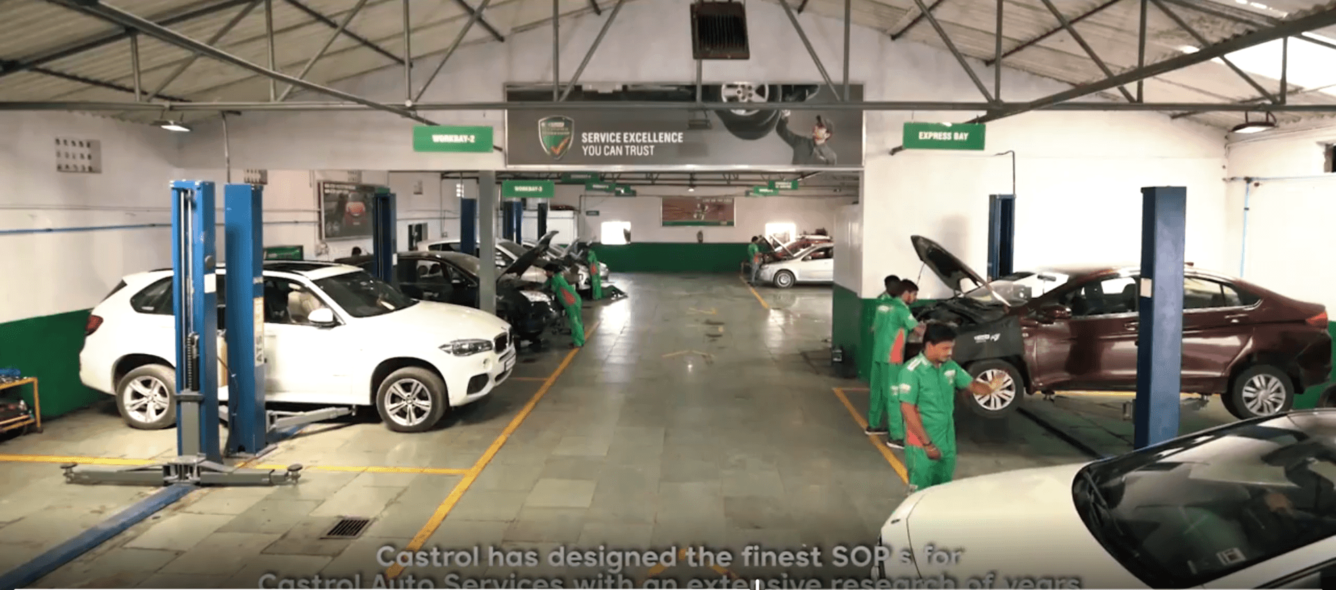 Workshop interior with cars on lifts
