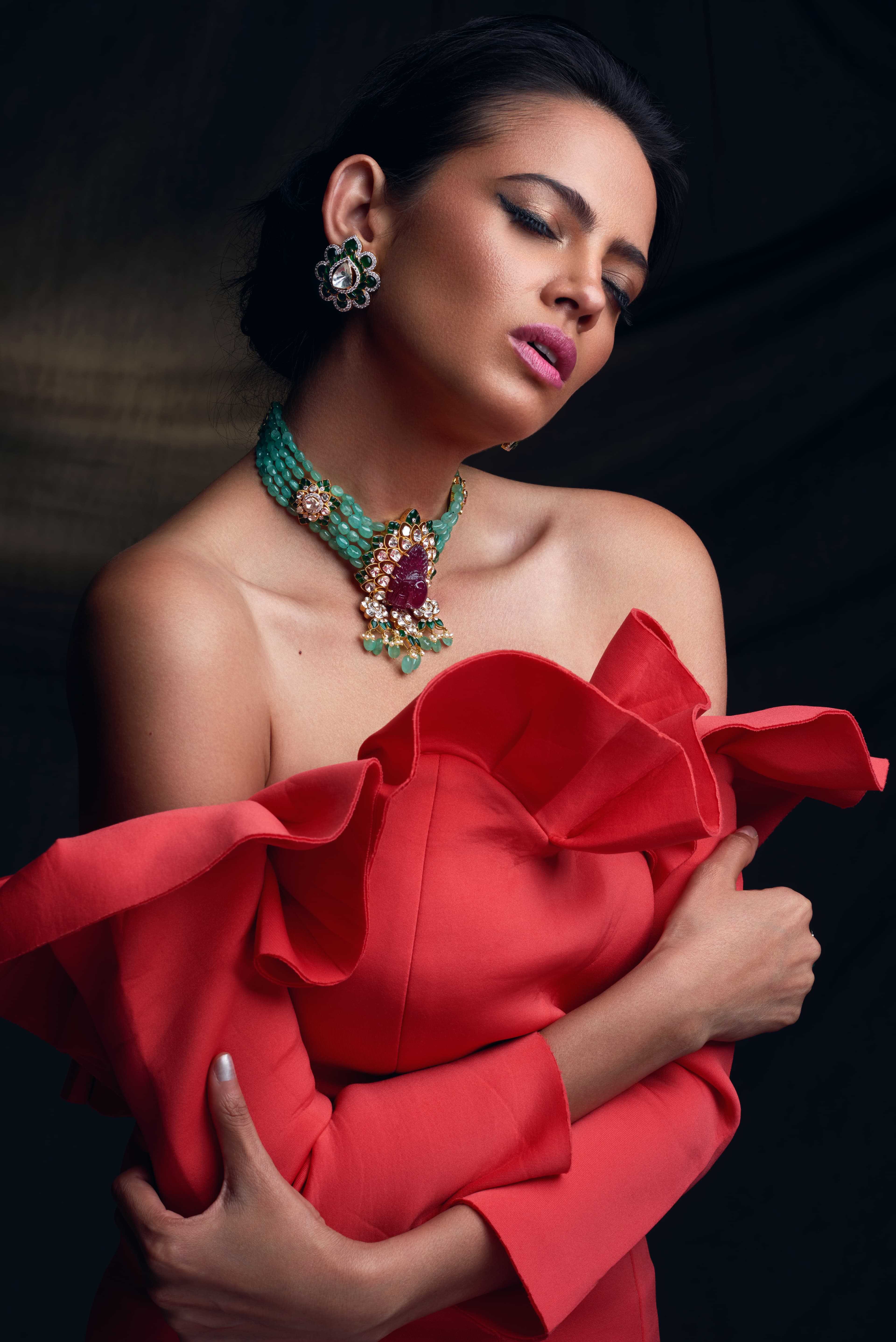 Jewellery campaign portrait with emerald kundan choker and coral dress