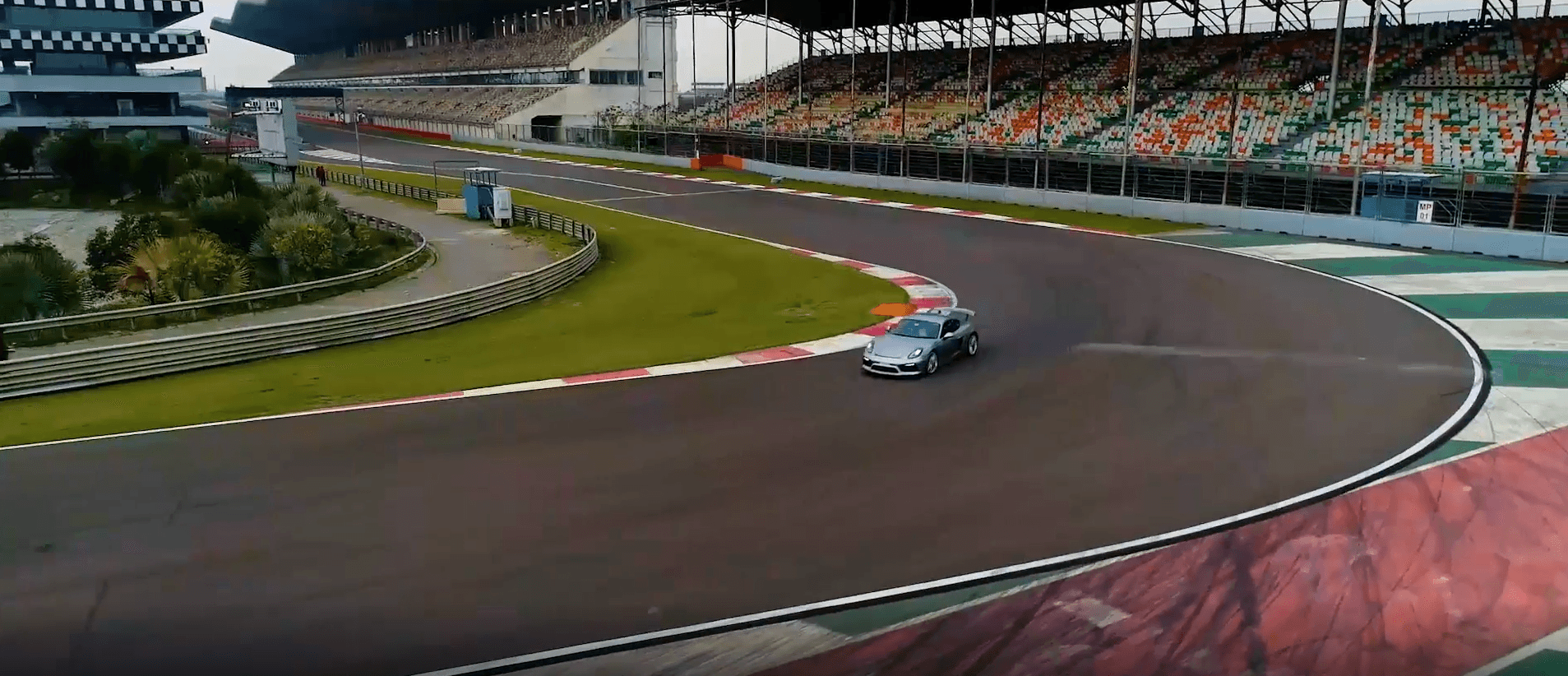 Aerial drone view of a Porsche in a corner