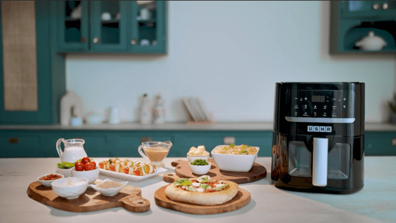 Usha air fryer in a teal kitchen